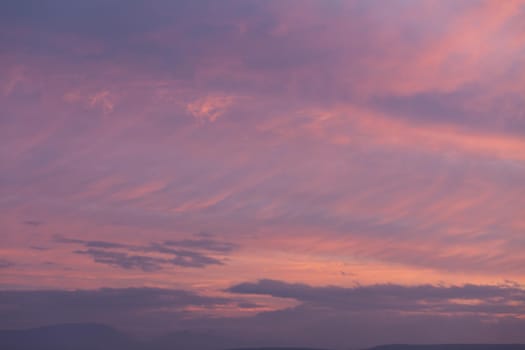 Abstract nature background. Colorful dramatic sky with cloud at sunset. Dramatic and moody pink, purple and blue cloudy sunset sky