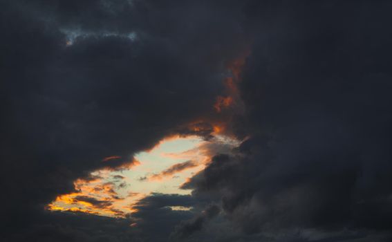 Natural background. Twilight beautiful sky. Twilight colorful sky and clouds with sunlight shine behind background