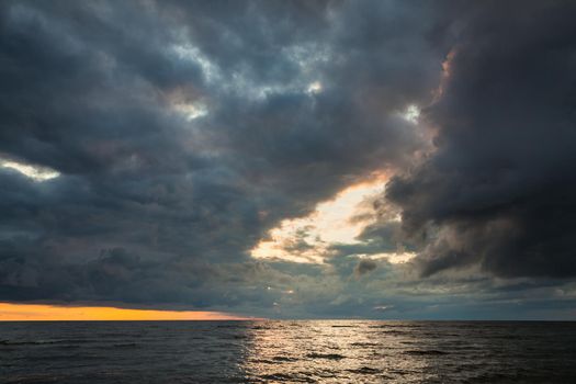 Dramatic sky with stormy clouds over the sea. Nature background