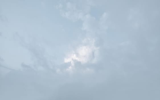 Natural sky background with clouds in light tonality. Abstract nature image for background use.