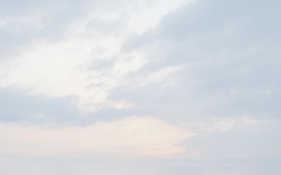 Natural sky background with clouds in light tonality. Abstract nature image for background use.