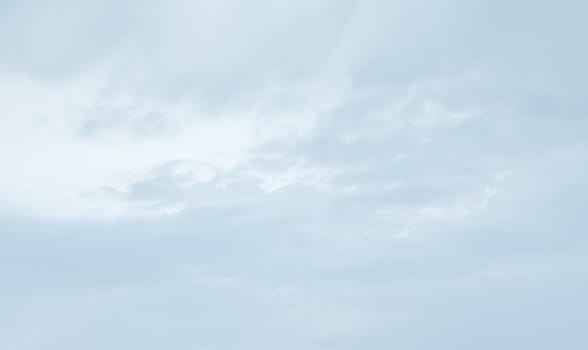 Natural sky background with clouds in light tonality. Abstract nature image for background use.