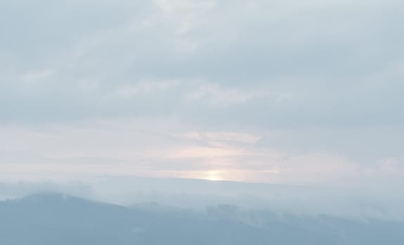 Natural sky background with clouds in light tonality. Abstract nature image for background use.