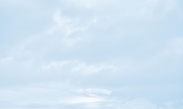 Natural sky background with clouds in light tonality. Abstract nature image for background use.