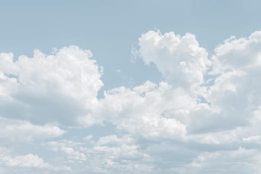 Natural sky background with clouds in light tonality. Abstract nature image for background use.
