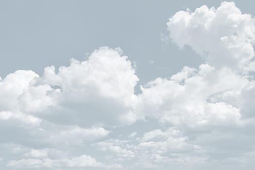 Natural sky background with clouds in light tonality. Abstract nature image for background use.