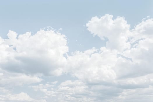 Natural sky background with clouds in light tonality. Abstract nature image for background use.