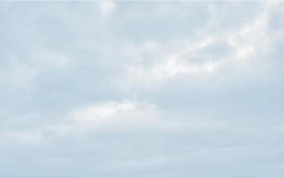 Natural sky background with clouds in light tonality. Abstract nature image for background use.
