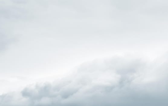 Natural sky background with clouds in light tonality. Abstract nature image for background use.