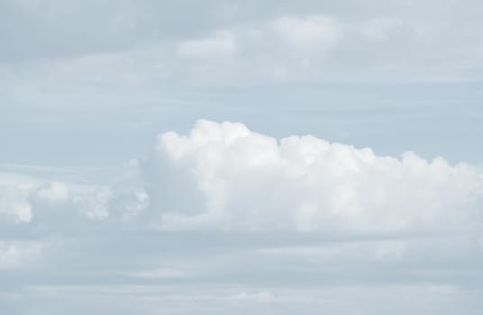 Natural sky background with clouds in light tonality. Abstract nature image for background use.