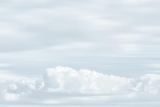 Natural sky background with clouds in light tonality. Abstract nature image for background use.