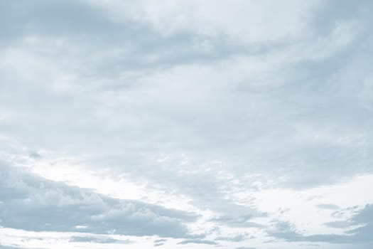 Natural sky background with clouds in light tonality. Abstract nature image for background use.