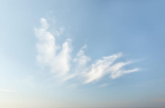 Natural sky background with clouds in light tonality. Abstract nature image for background use.