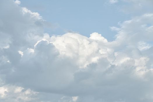 Natural sky background with clouds in light tonality. Abstract nature image for background use.