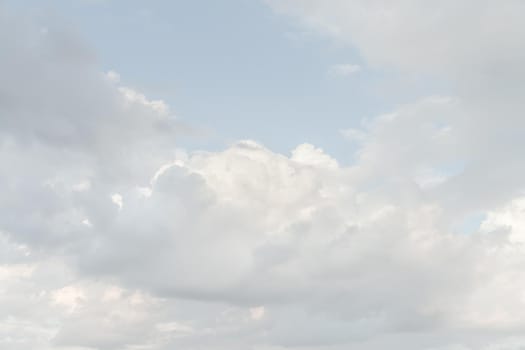 Natural sky background with clouds in light tonality. Abstract nature image for background use.