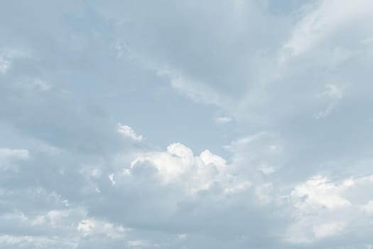 Natural sky background with clouds in light tonality. Abstract nature image for background use.