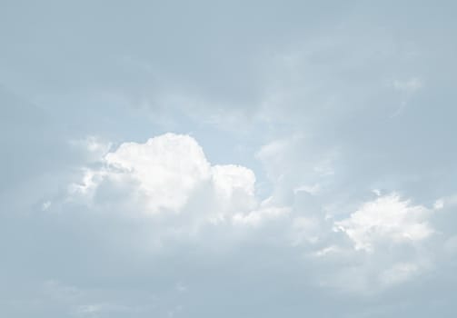 Natural sky background with clouds in light tonality. Abstract nature image for background use.
