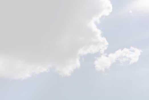 Natural sky background with clouds in light tonality. Abstract nature image for background use.