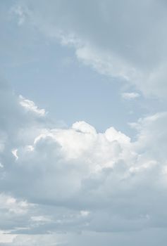 Natural sky background with clouds in light tonality. Abstract nature image for background use.