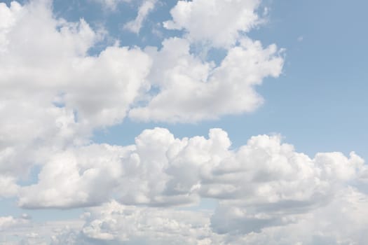 Natural sky background with clouds in light tonality. Abstract nature image for background use.