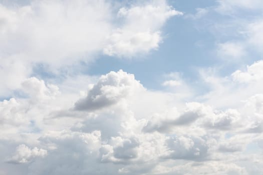 Natural sky background with clouds in light tonality. Abstract nature image for background use.