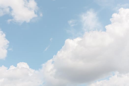 Natural sky background with clouds in light tonality. Abstract nature image for background use.