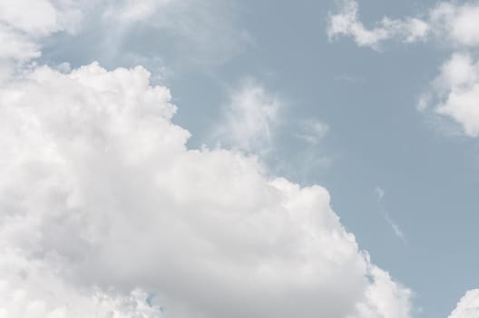 Natural sky background with clouds in light tonality. Abstract nature image for background use.