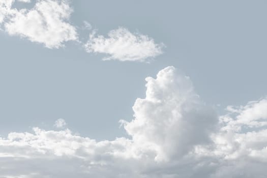 Natural sky background with clouds in light tonality. Abstract nature image for background use.