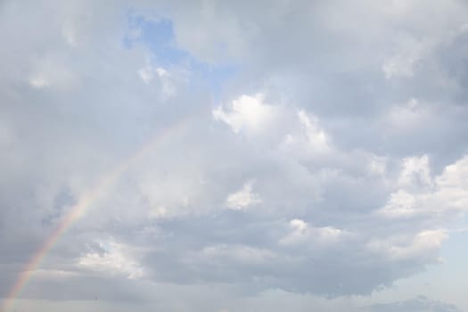 Natural sky background with clouds in light tonality. Abstract nature image for background use.