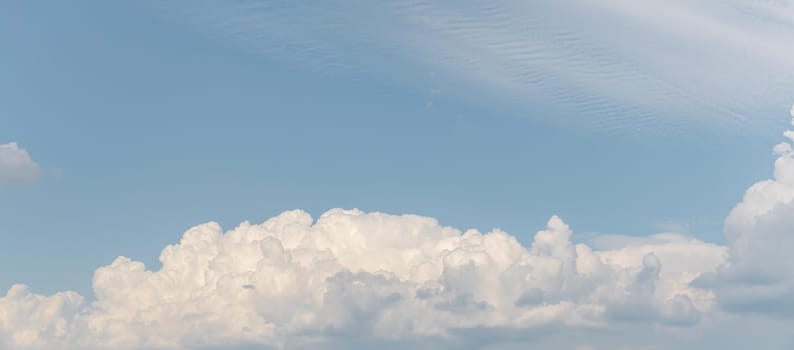 Abstract natural background. Beautiful white clouds against blue sky