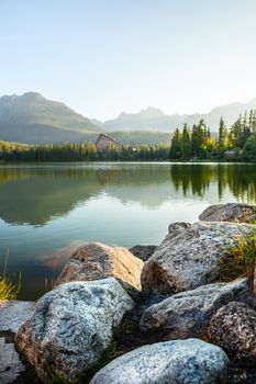 Mountain lake in High Tatra. Strbske pleso, Slovakia, Europe. Focus on stones