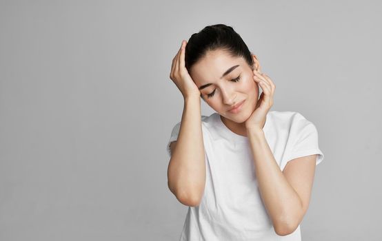 woman in white t-shirt cropped view health problem headache. High quality photo