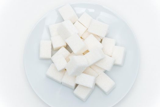 refined sugar on a plate calories sweets. High quality photo