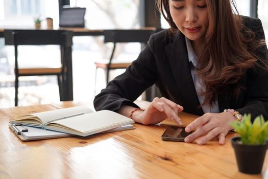 business, technology concept - Portrait of woman hands texting message on smartphone at office