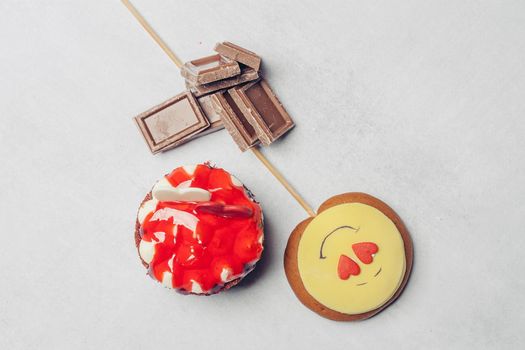 gingerbread in the form of a smiley on a stick marmalade sweets dessert. High quality photo