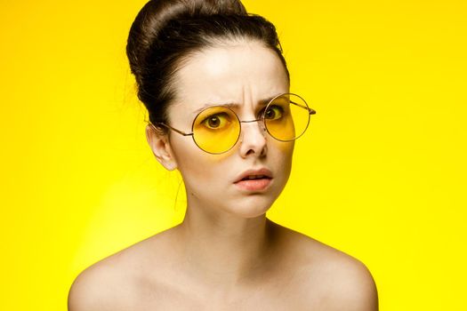 brunette naked shoulders glasses emotions attractive look. High quality photo
