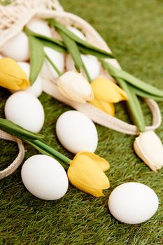tulips white eggs easter grass holiday decoration. High quality photo