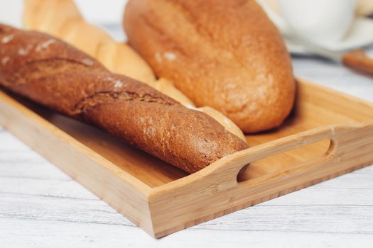 fresh loaf bread bins on the table kitchen food ration breakfast. High quality photo