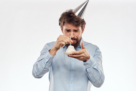 Happy guy with birthday cake white background Compact corporate party cropped beard view. High quality photo