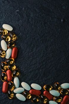Frame made of medical pills as flatlay background, health and wellness closeup
