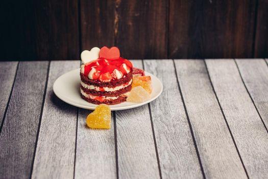 red cake on a plate dessert sweets candy snack close-up. High quality photo