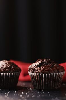 Two chocolate muffins freshly baked at home, homemade comfort food recipe concept