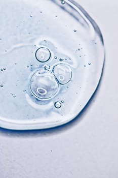 Transparent gel cream bubbles as cosmetics background, hygiene and science closeup