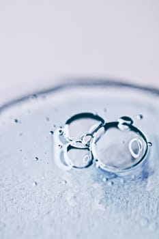 Transparent gel cream bubbles as cosmetics background, hygiene and science closeup