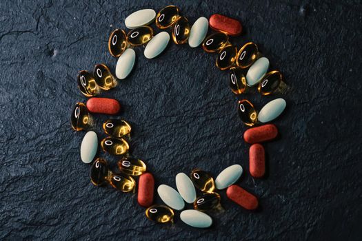 Frame made of medical pills as flatlay background, health and wellness closeup