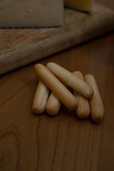 Breadsticks on a wooden table with very good appearance