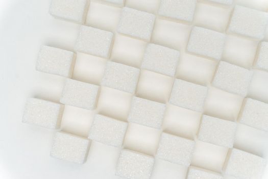 refined sugar staggered glucose ingredient calories light background. High quality photo