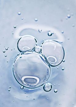 Transparent gel cream bubbles as cosmetics background, hygiene and science closeup