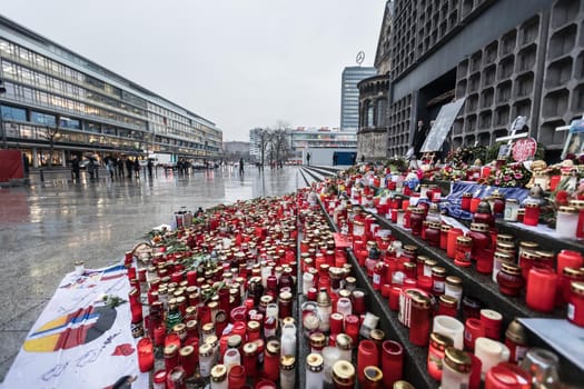 BERLIN, GERMANY - Jan 30, 2017: Candles and flowers in tribute to victims of December 19, 2016 terrorist attack in the center of western Berlin