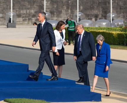 BRUSSELS, BELGIUM - Jul 11, 2018: NATO Secretary General Jens Stoltenberg, US President Donald Trump and British Prime Minister Teresa May during the summit of the NATO military alliance